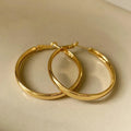 Circular metal earrings with 40mm diameter in gold or silver electroplated finish