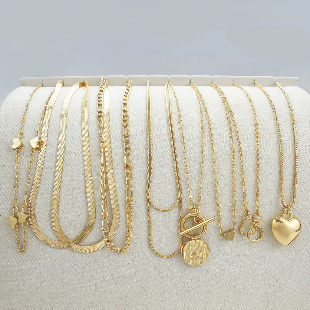 Women's 10 piece necklace set with gold electroplated finish and snake bone chain design