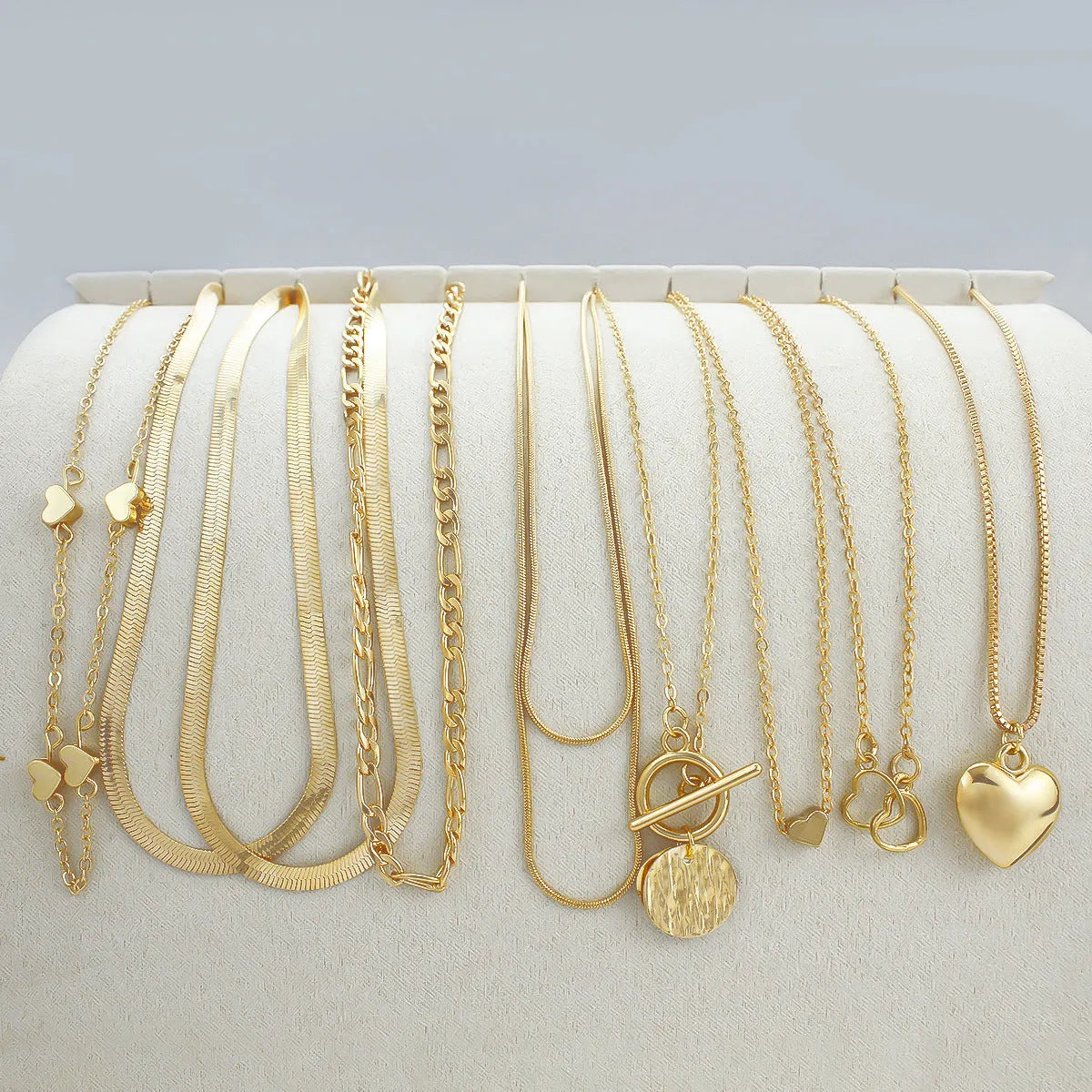 Women's 10 piece necklace set with gold electroplated finish and snake bone chain design