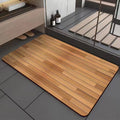 Square diatomaceous earth bathroom floor mat with wood grain pattern on bathroom tiles