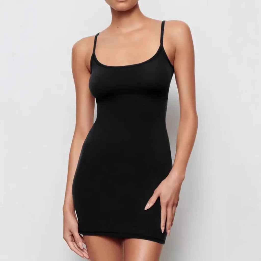 Black sleeveless sling sheath dress with a short skirt on a mannequin.