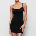 Black sleeveless sling sheath dress with a short skirt on a mannequin.