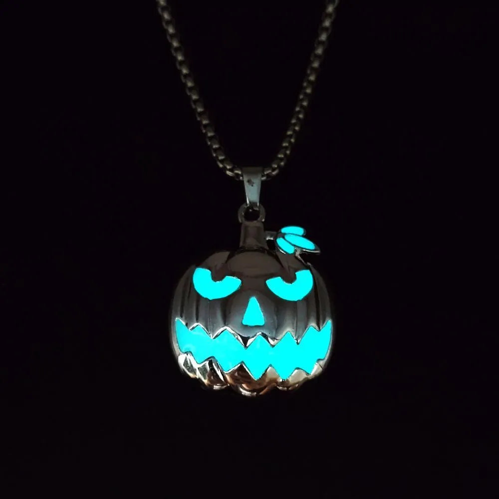 Luminous pumpkin pendant necklace with ghost face design glowing in the dark