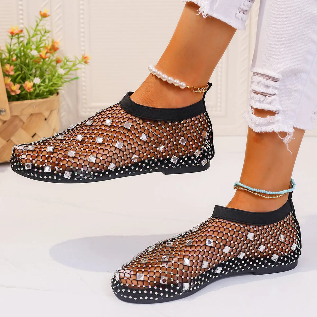 Women's flat sandals with mesh upper and colourful rhinestone design, round toe shape with rubber sole