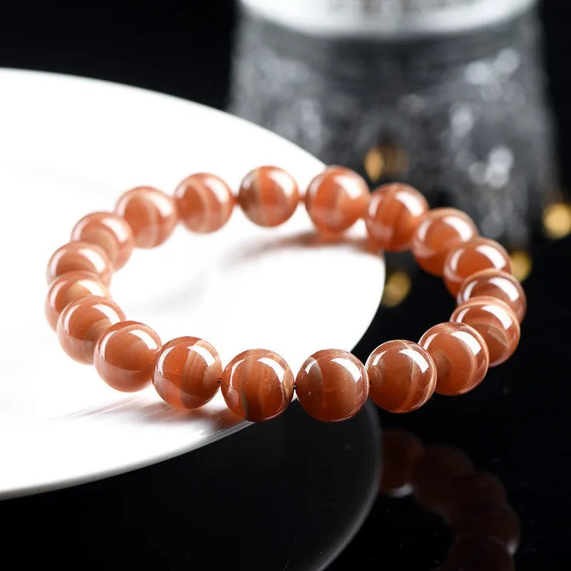 Natural Old Mine Rhodochrosite round bead bracelet with Ruyi element, choice of 6mm or 8mm beads.