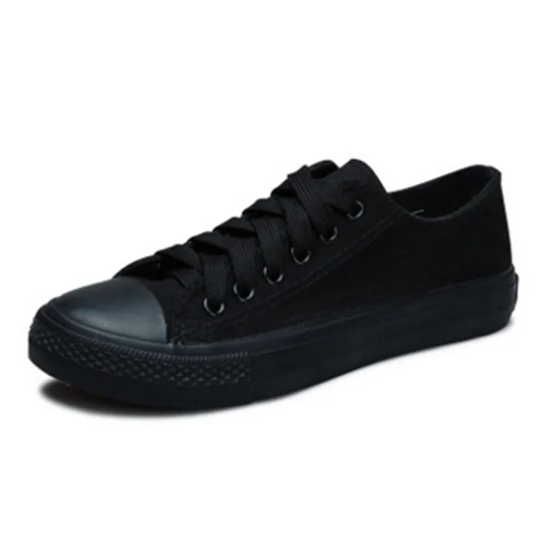 Women's solid colour canvas casual shoes showing available colours: all-black, black, white-black, and white-red.