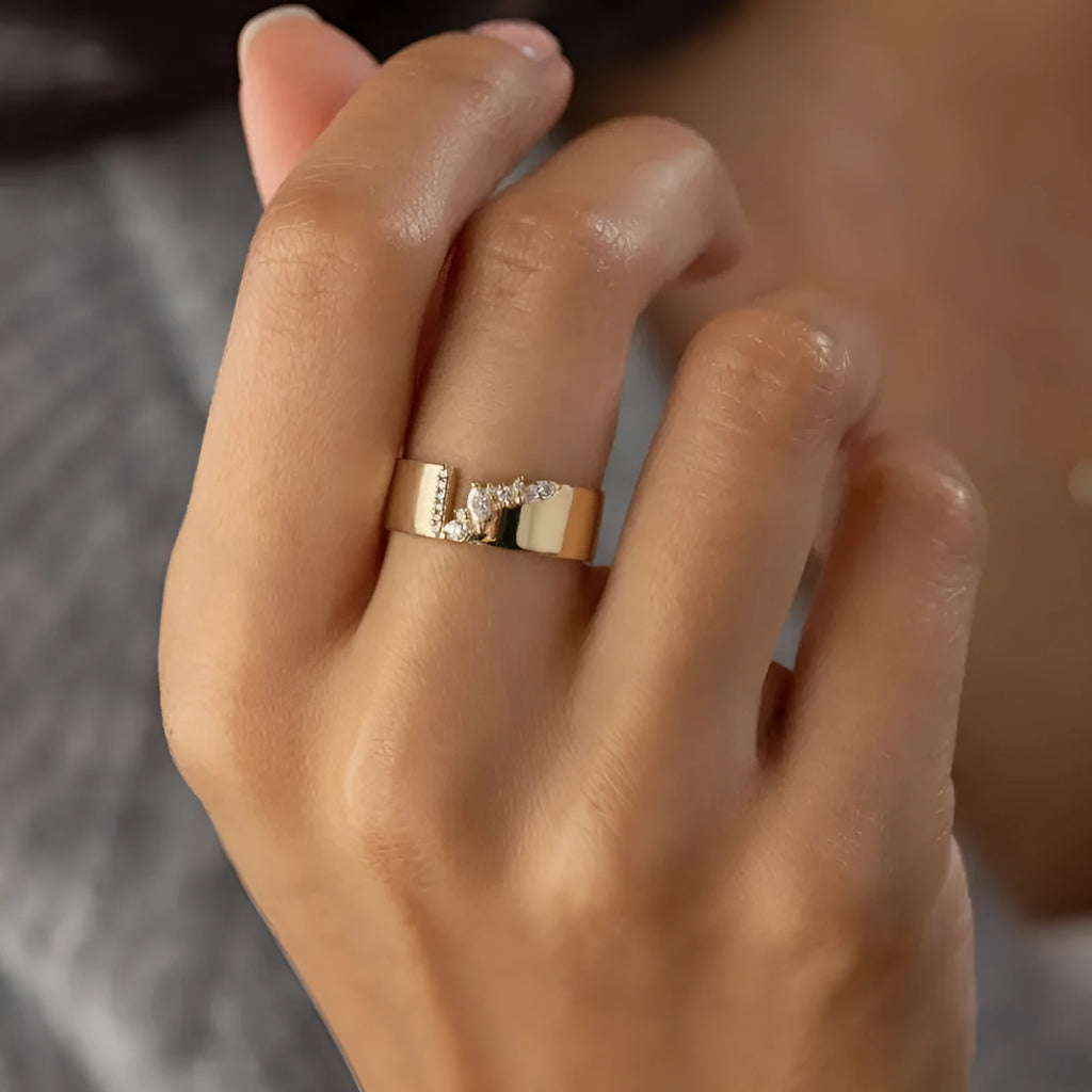 Gold-colour women's ring with zircon detailing showing electroplated finish and sizing options