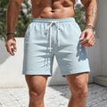 Men's solid colour polyester track shorts in a straight, loose casual fit.