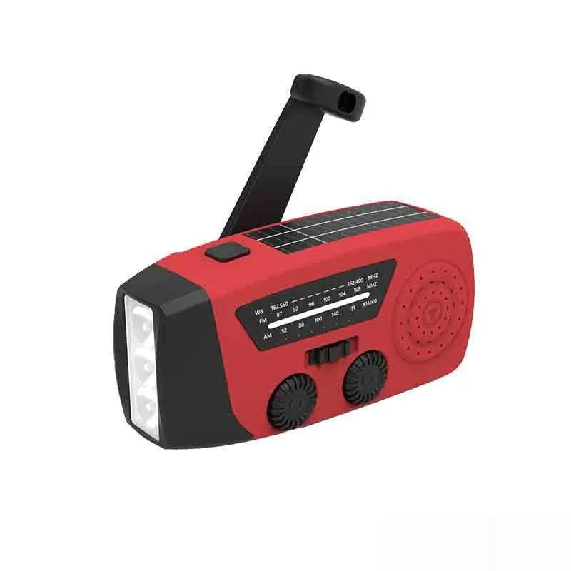 Red rechargeable emergency hand radio with built-in torch showing compact dimensions and wrist strap