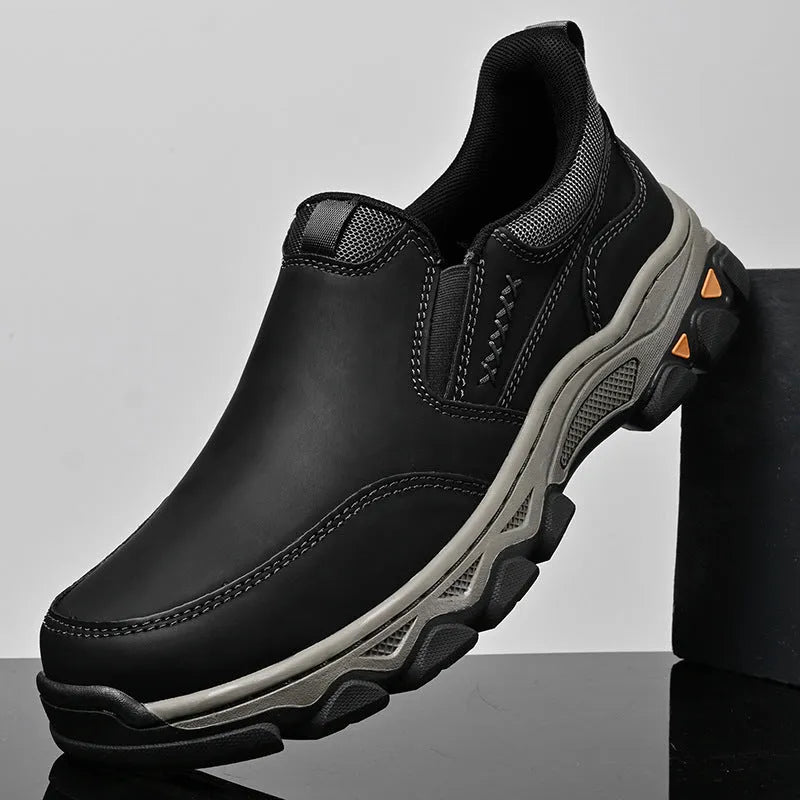 Men's black casual leather-look shoes with round toe and flat rubber sole.
