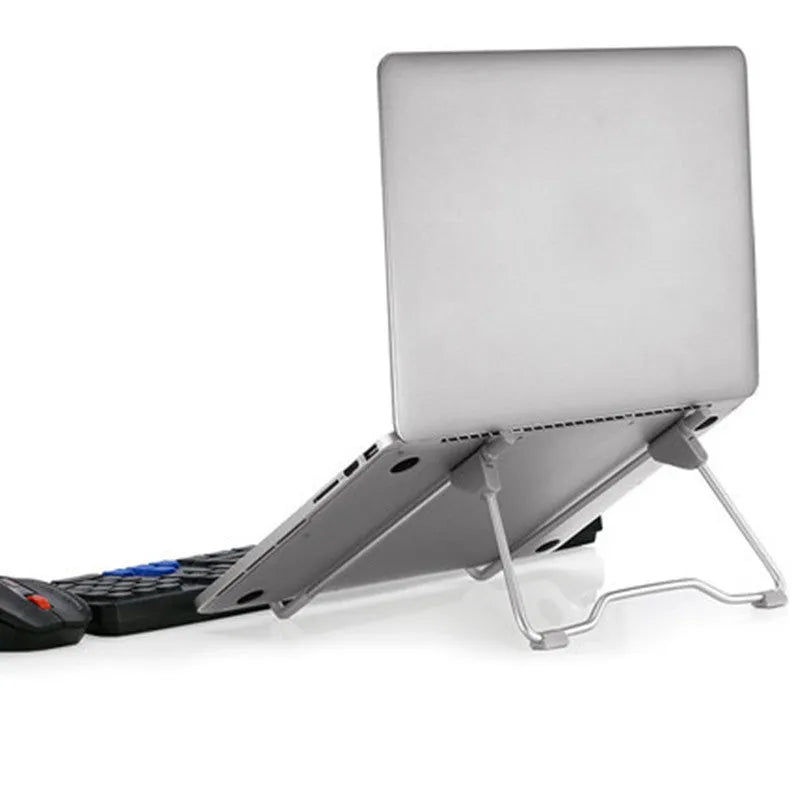 Grey aluminium alloy mobile phone and laptop stand on a wooden desk.