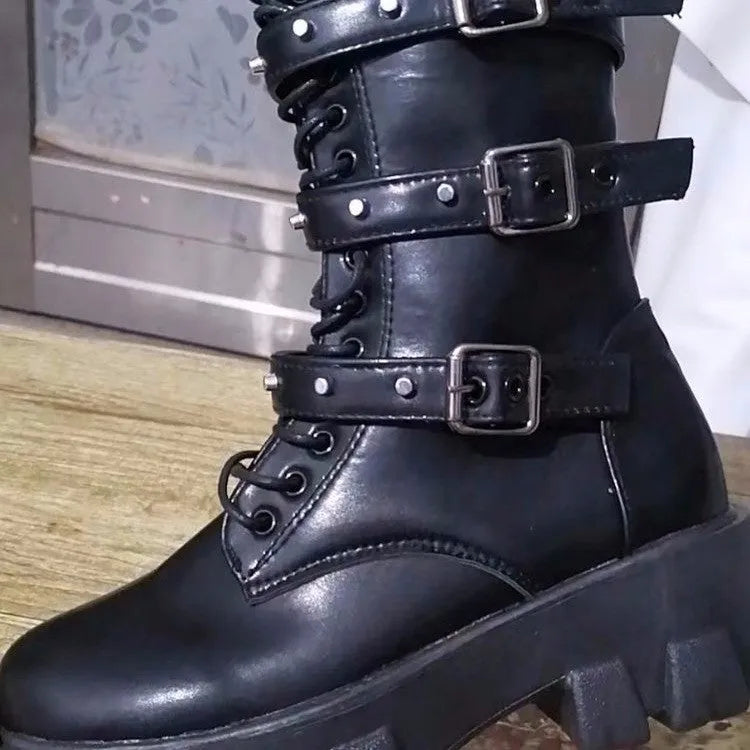 Women's black mid-calf knight boots with side zip and metal buckle details on artificial PU upper
