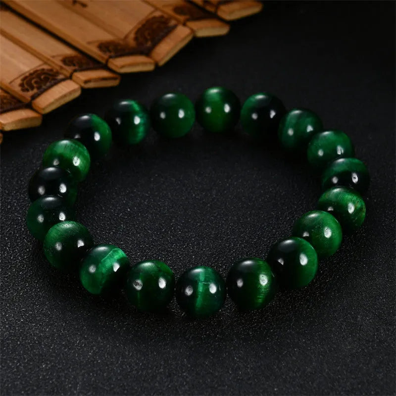 Green tiger eye stone bracelet with geometry-shaped polished beads