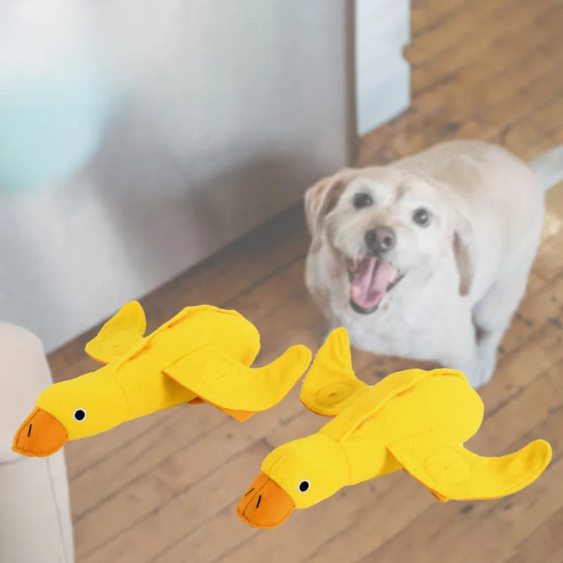 Yellow teddy duck dog toy with food leak openings and squeaker for training and chewing