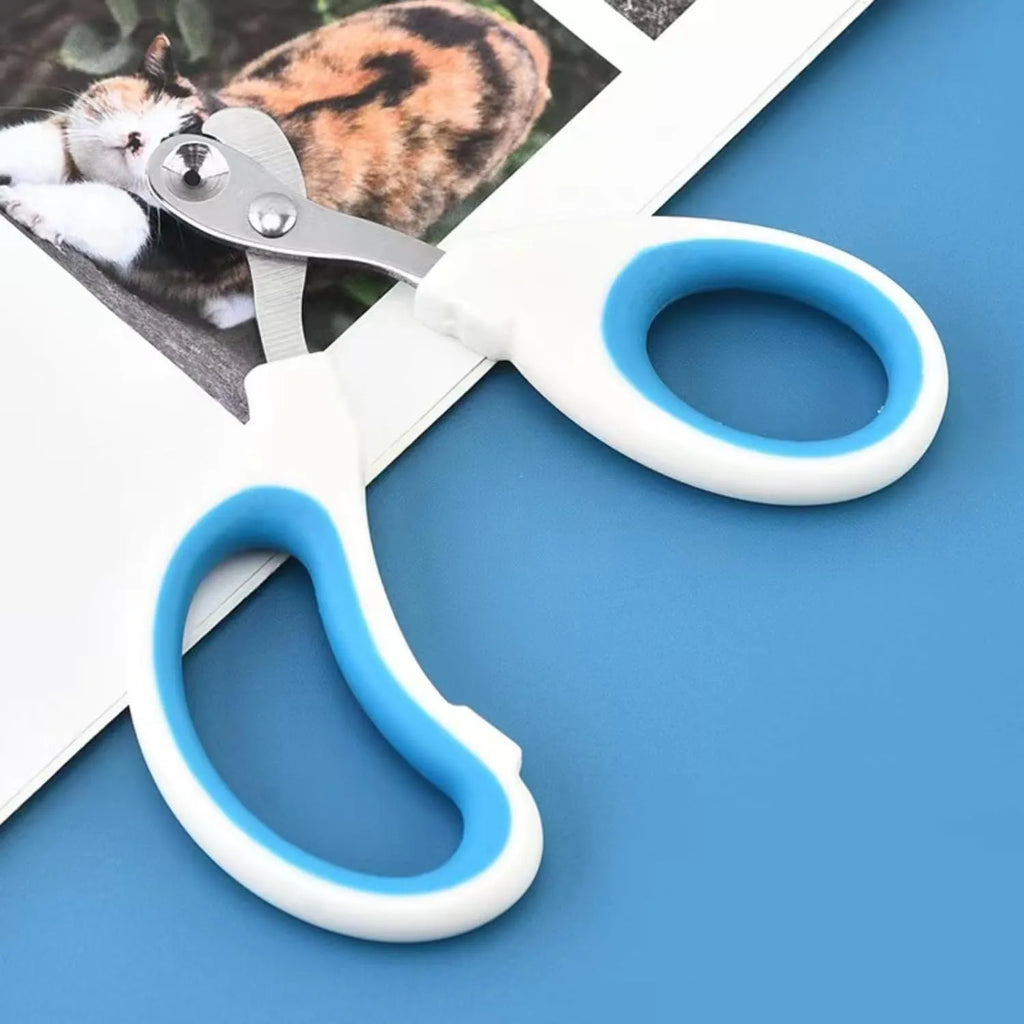 Blue pet nail clippers with circular cutting hole and cushioned non-slip handle for cats and small animals.