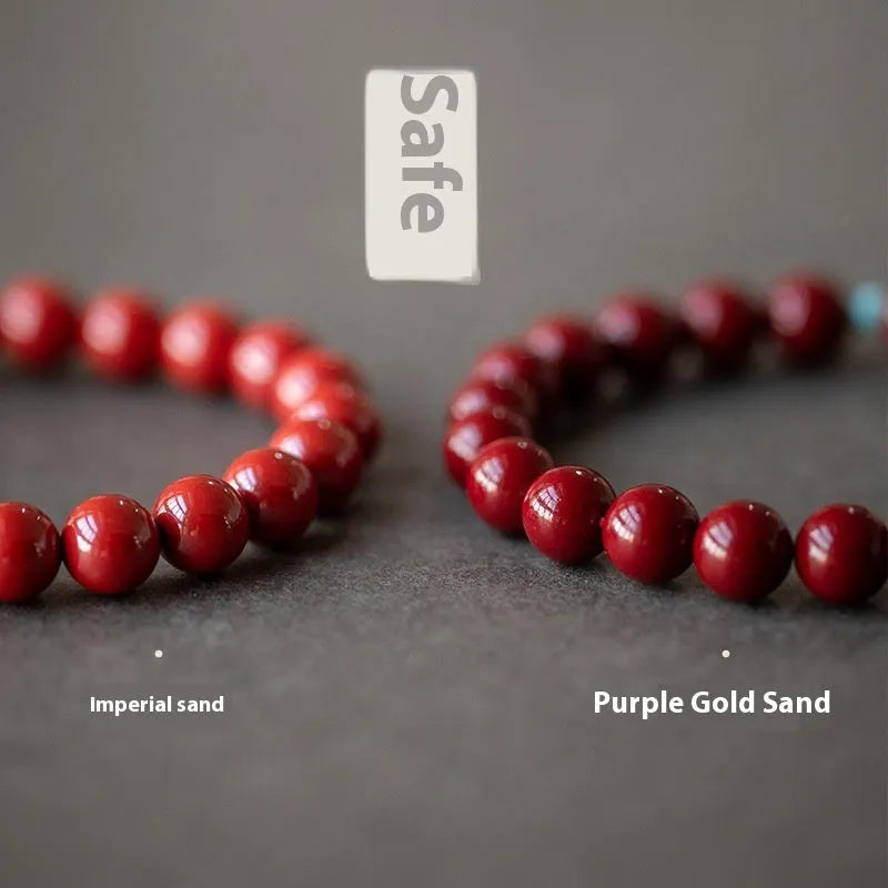 Purple gold sand cinnabar and Hetian jade beaded bracelet with geometric ellipse shapes on a wrist.