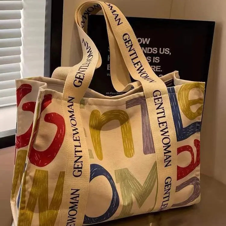 Large capacity canvas tote bag with printed letter design for women's travel and shopping