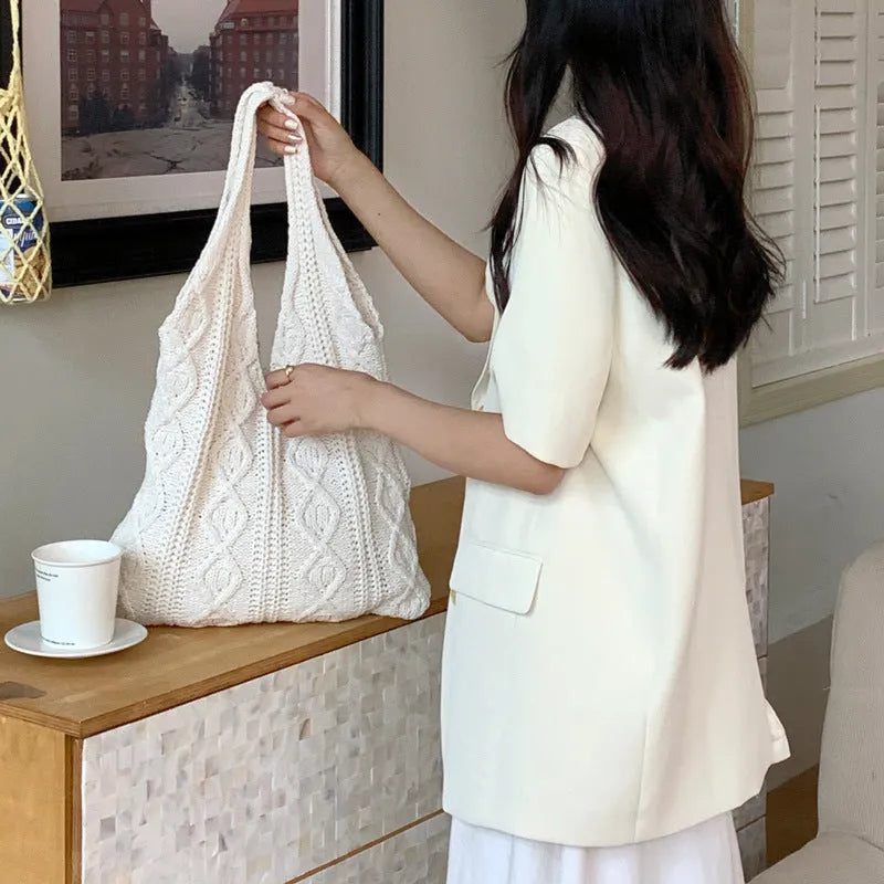Retro hollow knitted women's tote bag in a solid colour with double shoulder straps.