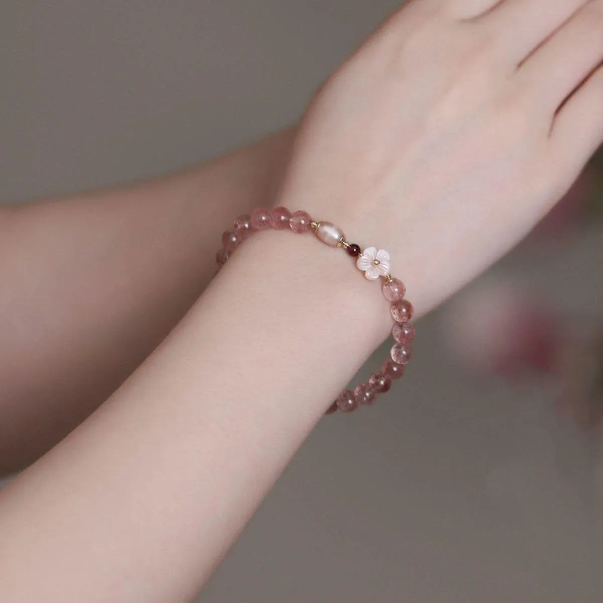 Women's strawberry quartz crystal floral bracelet with adjustable silver-tone chain