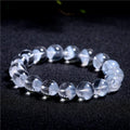 Women's white crystal ghost pyramid bracelet with ruyi element on wrist