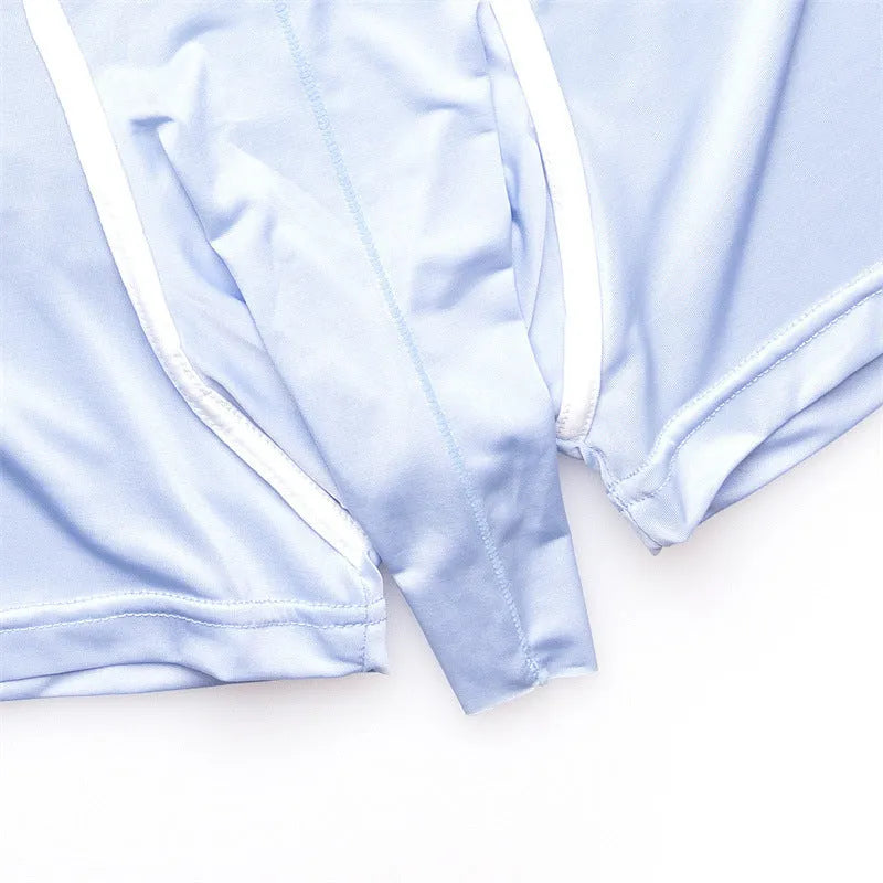 Men's solid colour ice silk boxer shorts in blue, showing mid waist design on a grey background.