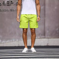 Men's loose straight-leg workwear shorts in fluorescent green or army green colours with micro-elastic polyester blend fabric