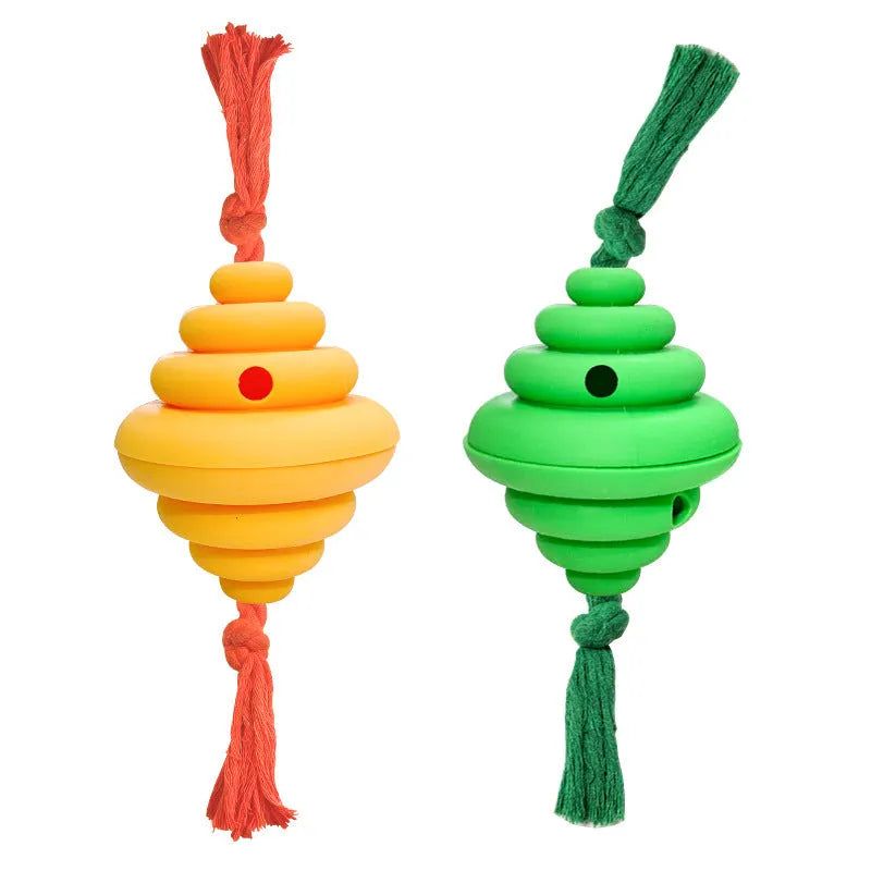 Green and yellow silicone dog ball with attached rope for tug-of-war and treat dispensing