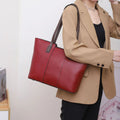 Genuine leather women's commuter shoulder bag in box-type design with large capacity and internal phone pocket