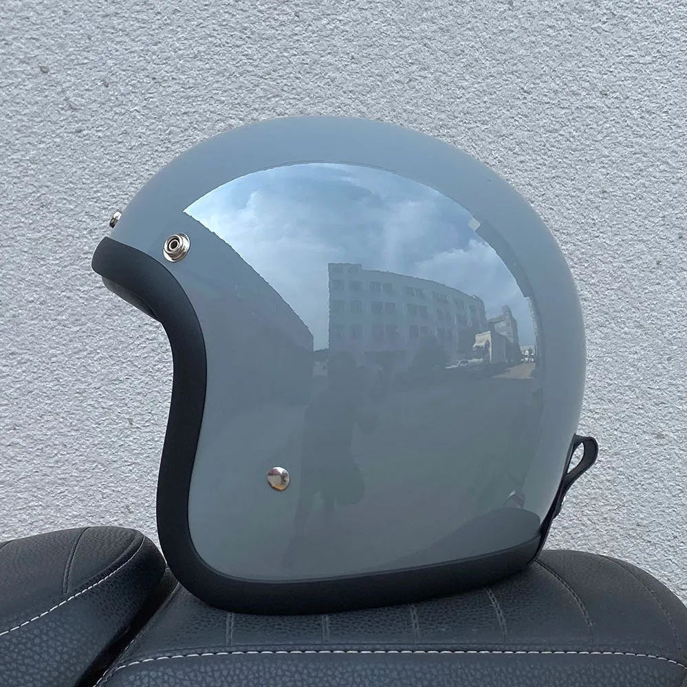 FRP fibreglass motorcycle half helmet shown in cement grey colour, suitable for electric bike commuting.