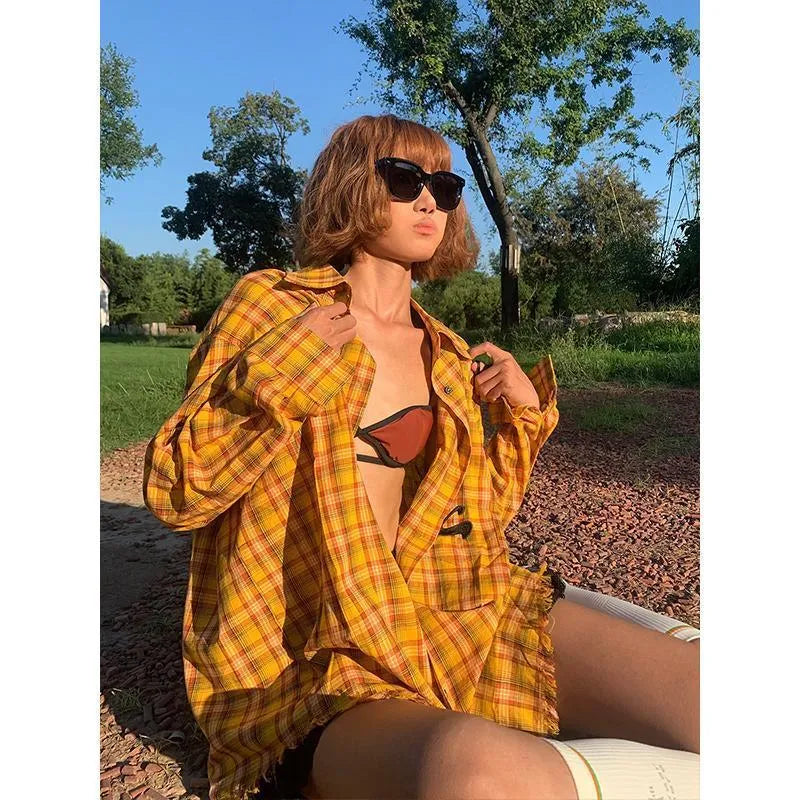 Dopamine yellow and black plaid shirt with a loose fit, shown on a hanger