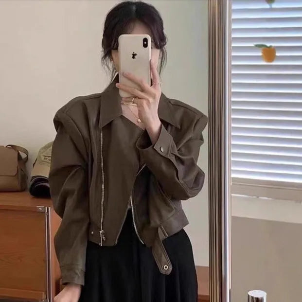 Women's brown retro slim fit imitation leather coat with long sleeves and pockets.