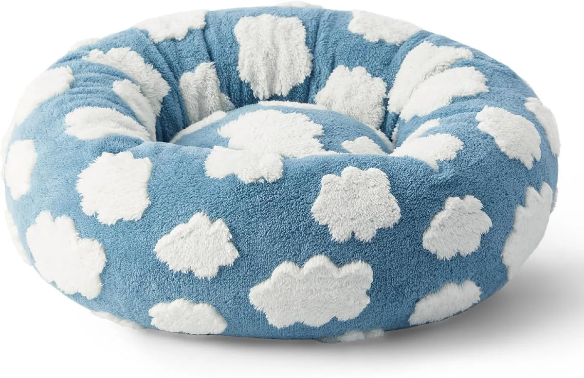 Round plaid dog bed with a plastic base, shown in a sea blue and white colour.