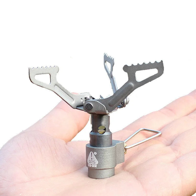 Silver portable mini titanium gas stove for camping and outdoor cooking, lightweight 25g