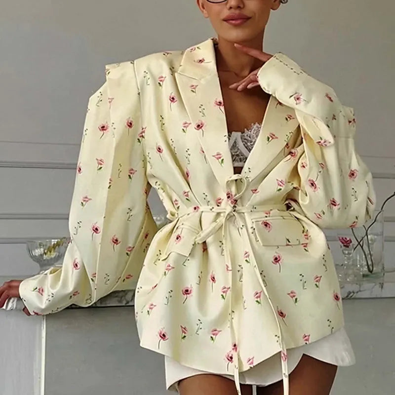 Women's white suit jacket with lace-up waist detail and collar, shown in regular fit with long sleeves