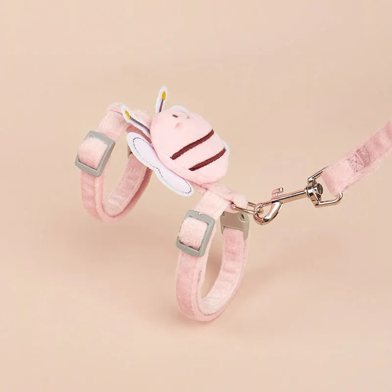 Bee-shaped pink cat harness and matching rope lead on a white background