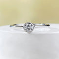 Minimalist crown-shaped silver ring with linear design in electroplated gold or platinum finish.
