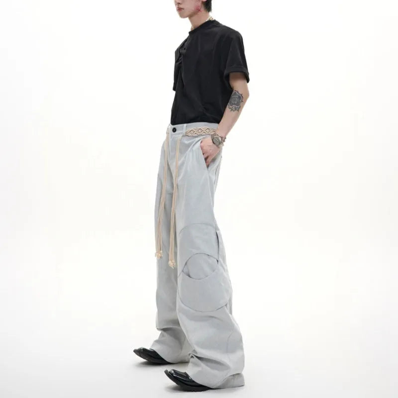 Men's straight-leg cotton jeans with decorative zipper details and tassel trim in dark colour options