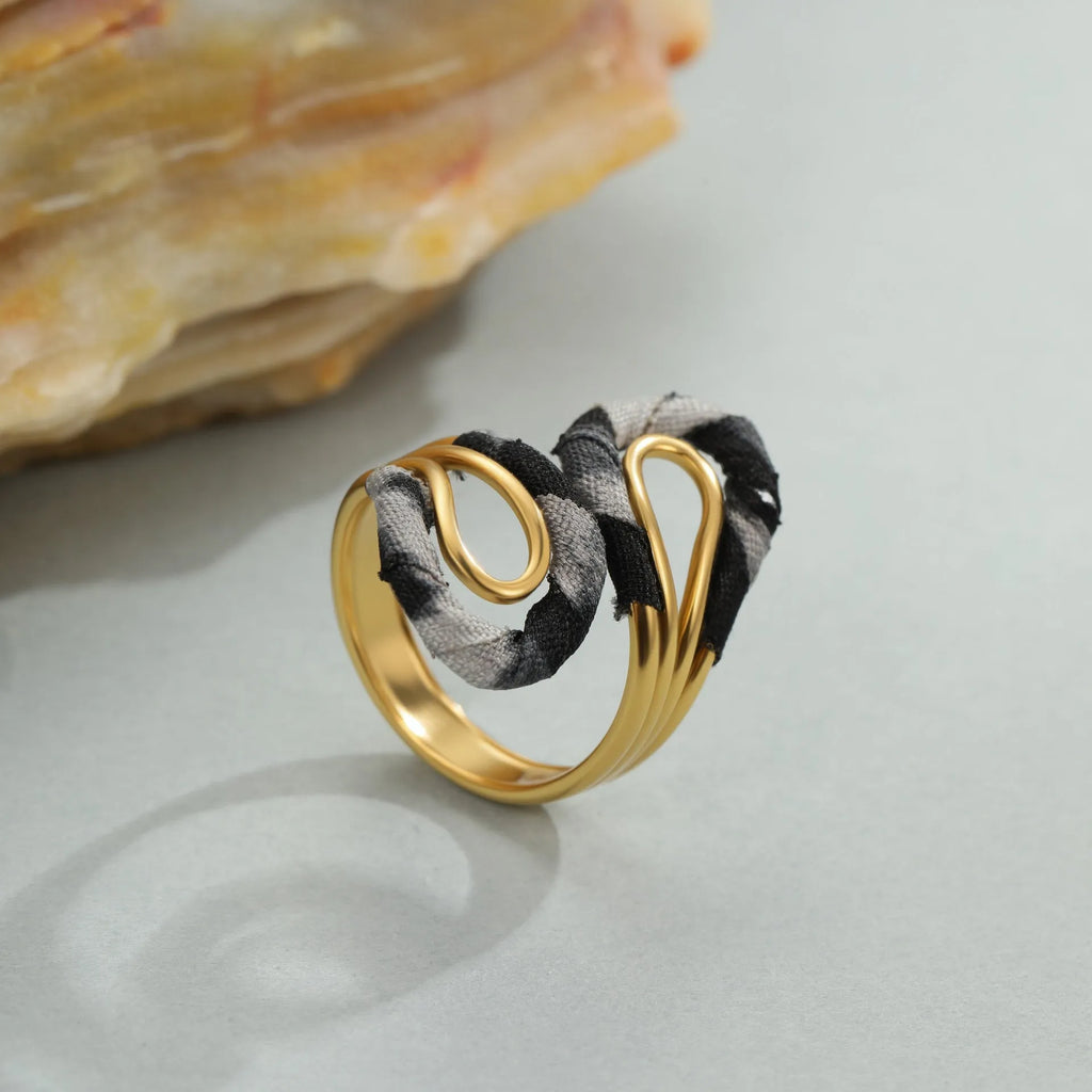 Stainless steel open mouth ring with leopard print geometric shapes in multiple colour options