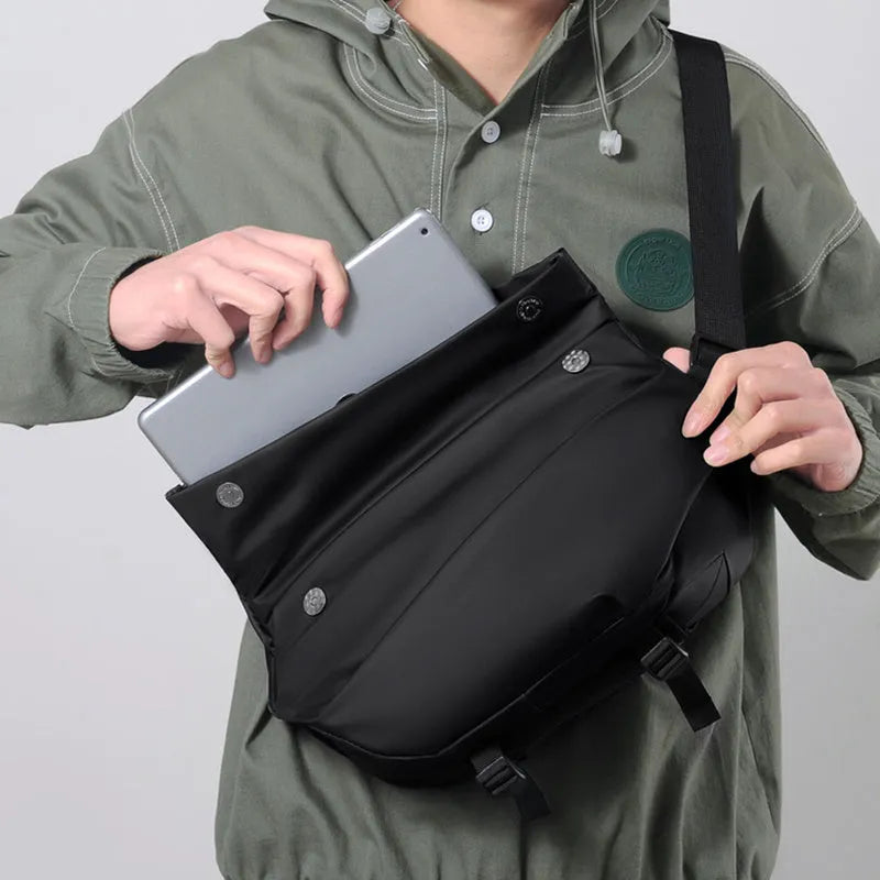 Men's grey medium crossbody bag with shoulder strap showing internal phone and document pockets