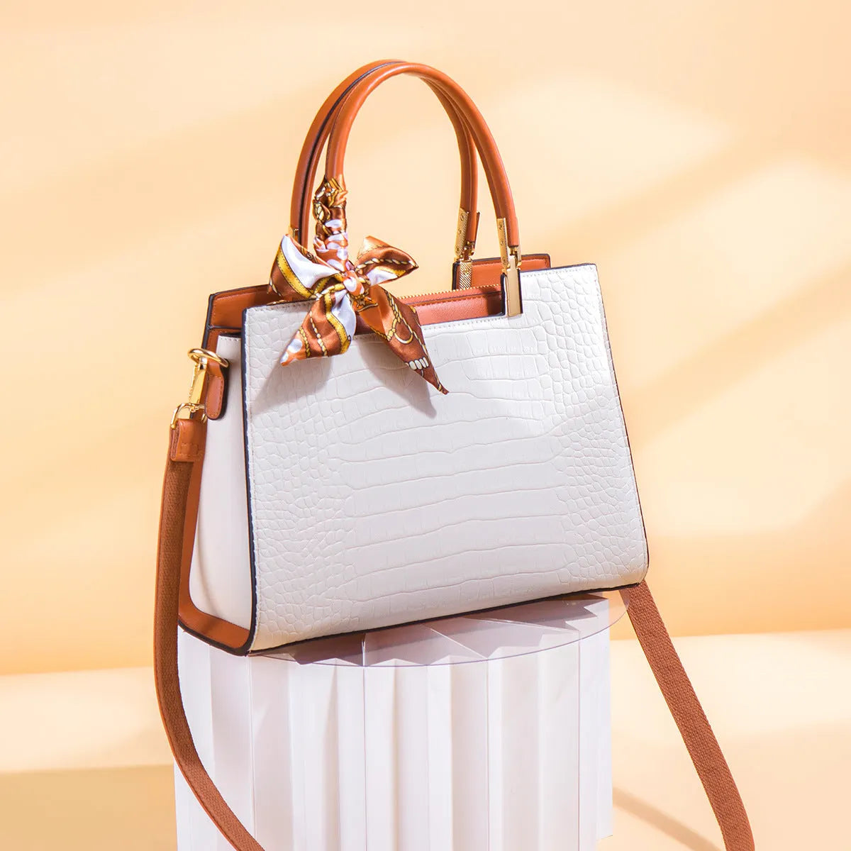 Milky white women's PU leather large-capacity shoulder handbag with internal organisers.
