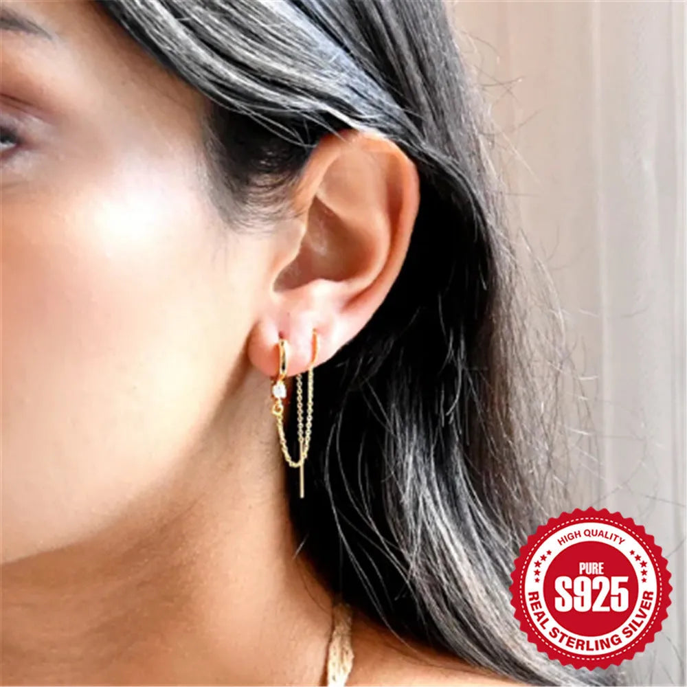 S925 sterling silver ear stud with flower, chain, and tassel detail in a golden electroplated finish.