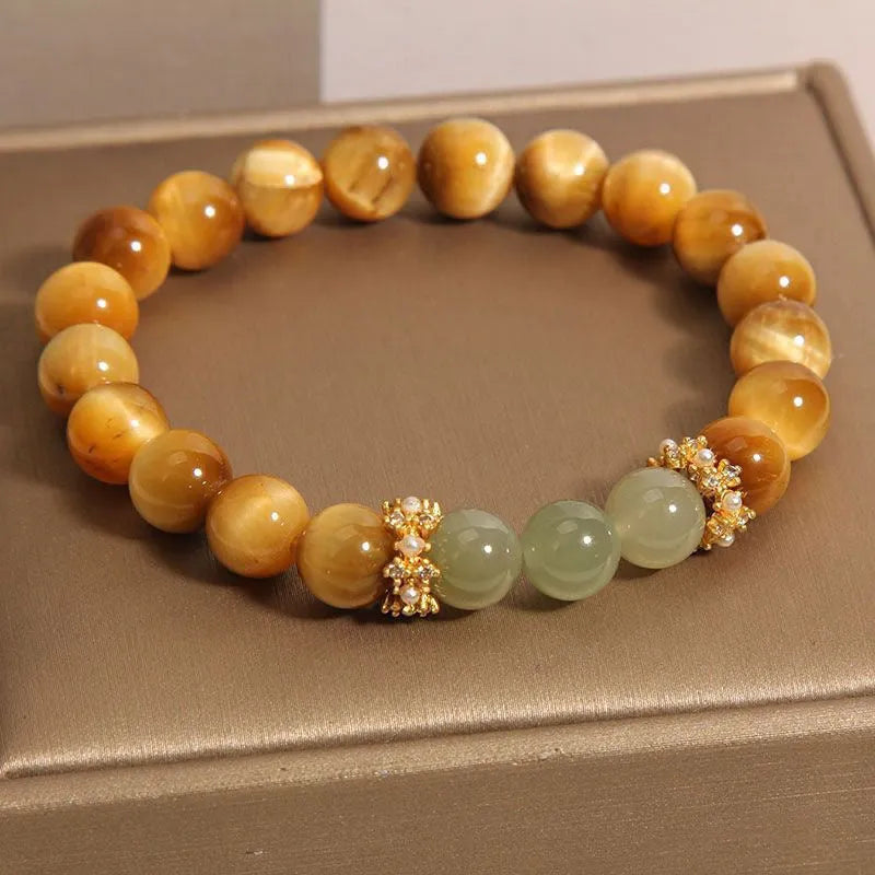 Natural yellow Tiger's Eye Hetian Jade bracelet with U-shaped design and auspicious patterns