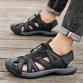 Men's blue and black casual sports shoes with mesh upper and Velcro strap.