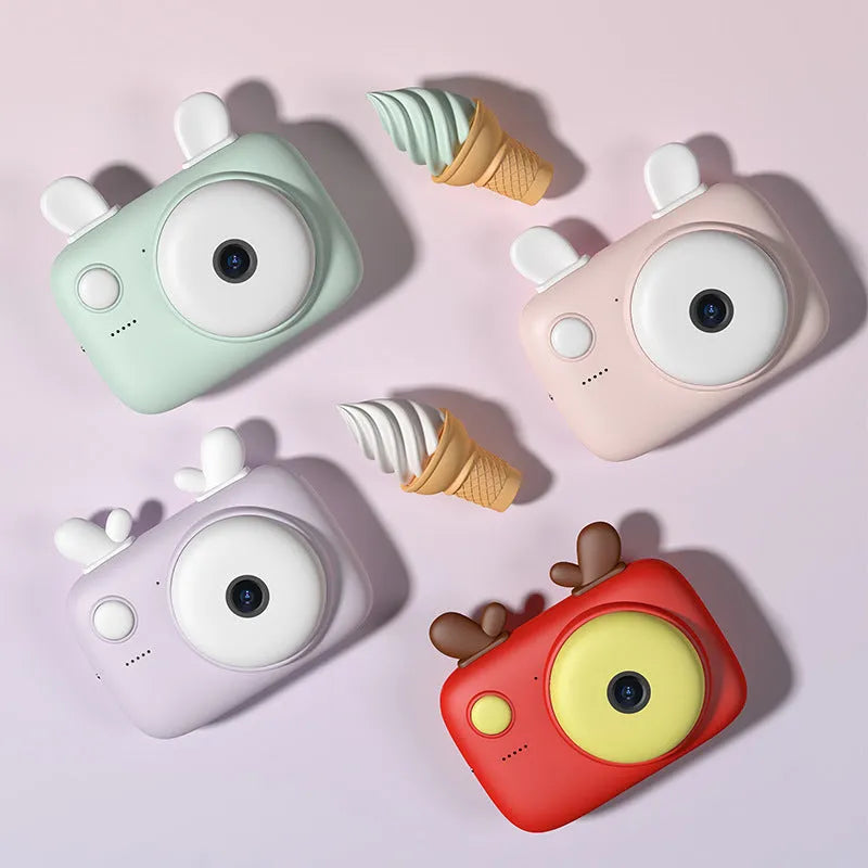A2 Macaron-style kids digital camera in green, showing its dual lenses and 2.4-inch screen.
