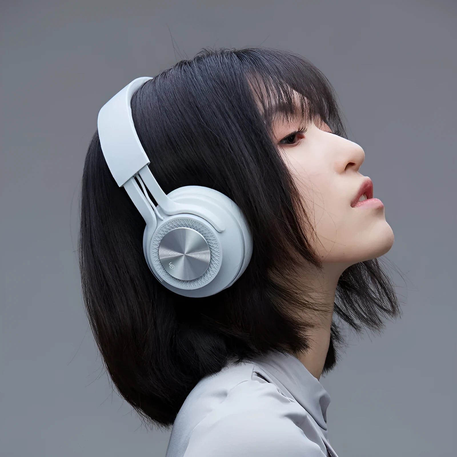 Sports wireless Bluetooth headset showing four colour options: black, green, grey and red