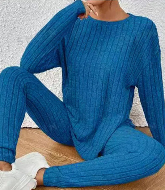 Black sunken stripe two-piece homewear set with pants and regular sleeve top on hanger