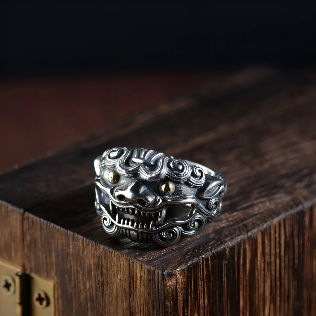 Sterling silver open ring with a detailed domineering jibeast animal and zodiac pattern.