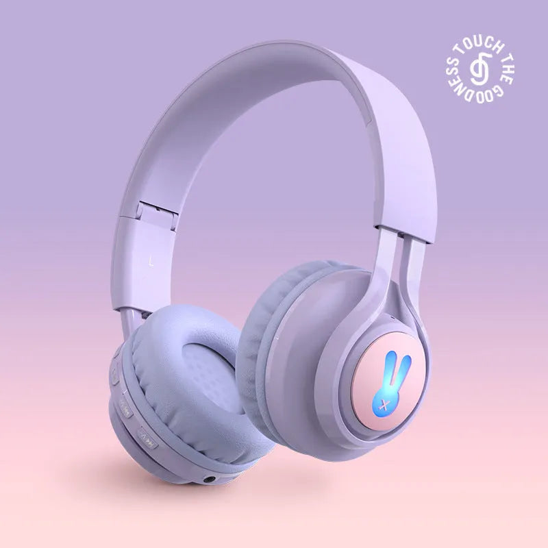 Wireless children's headphones with RGB LED lights in bunny pink colour showing power display