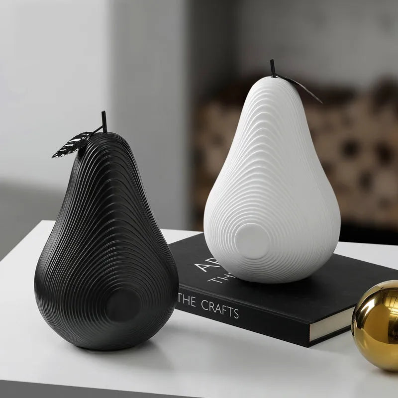 Resin craft decorative apple sculpture in black tall model with smooth finish on a white table