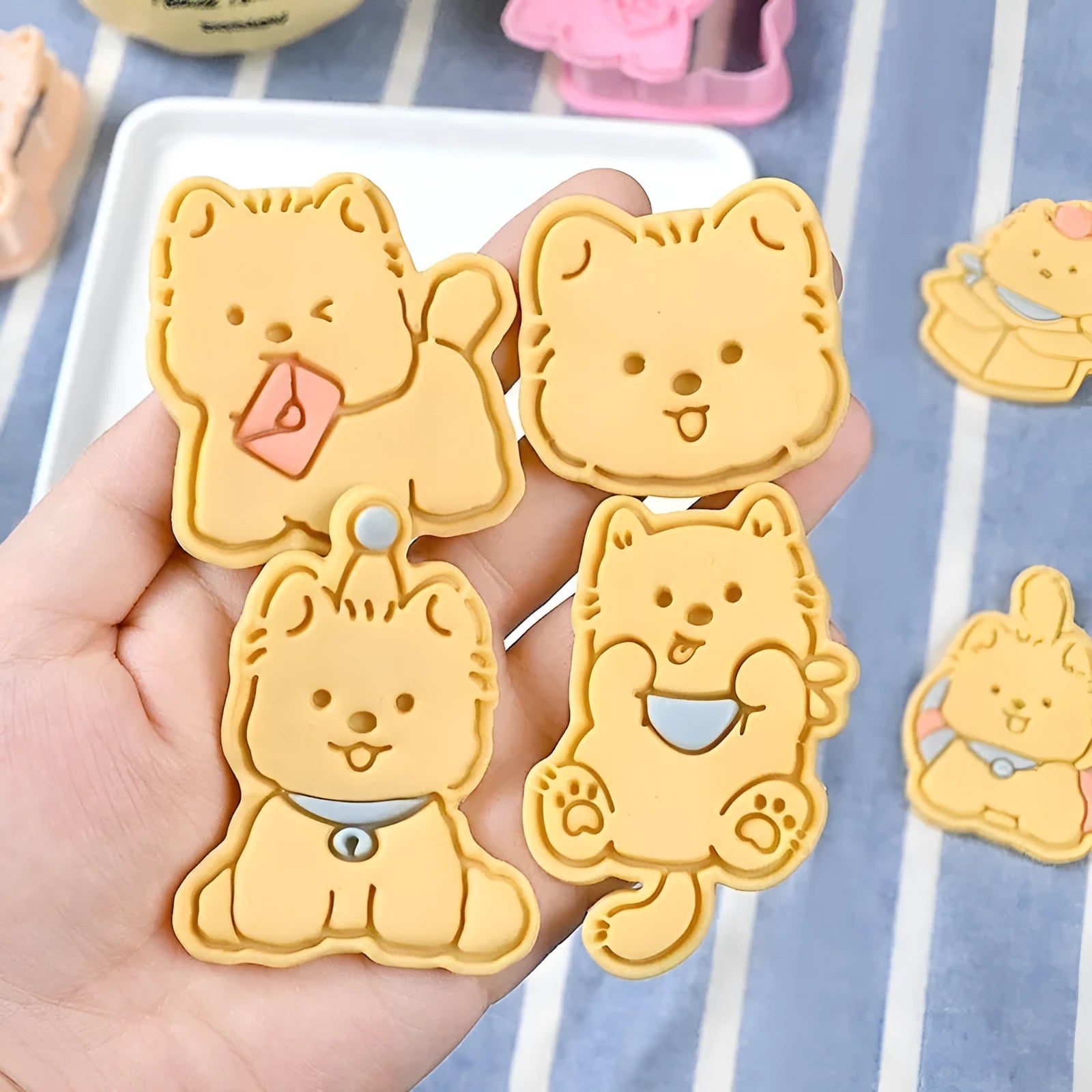 Three-dimensional plastic biscuit mould for making puppy-themed cookies with seven dog cartoon designs